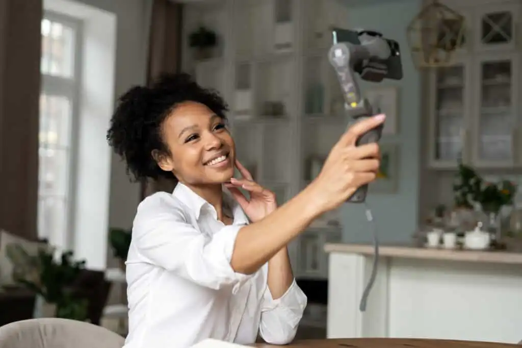 woman communicates by video link in social network uses phone